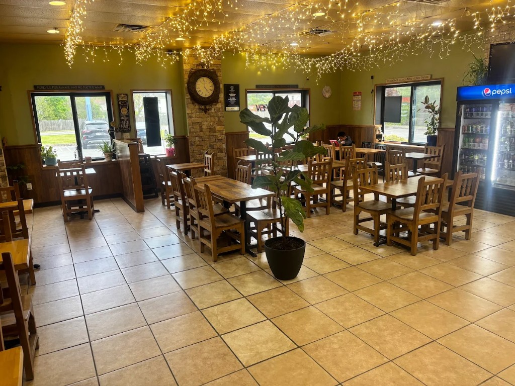 Cozy dining room with string lights at Pecorino's Pizzeria, Middletown NY